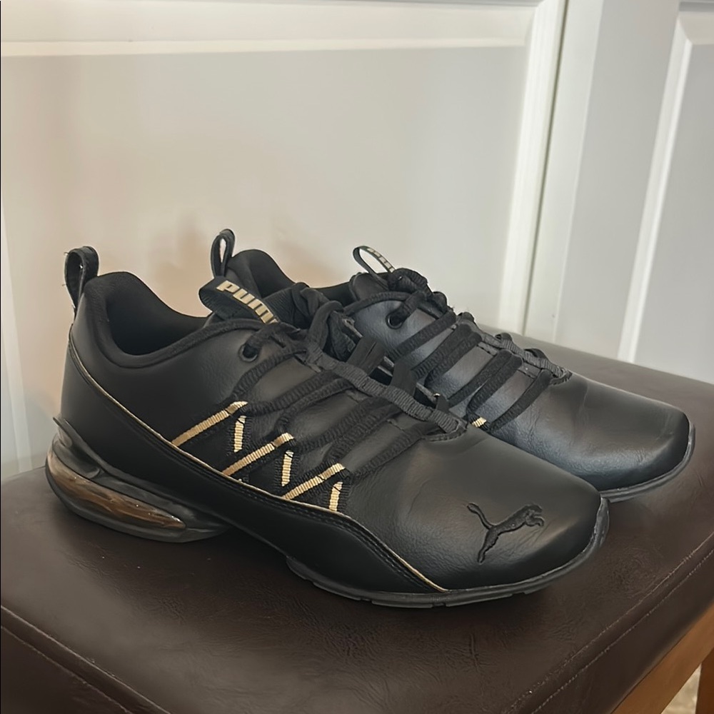 Puma Black and Gold Athletic Shoes with Cushioned Sole